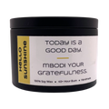 Mbodi 6 oz soy candle ‘Hello Sunshine’ in metal tin with bright yellow label designed for a bright, uplifting, and warm atmosphere