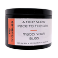 Mbodi 6 oz soy candle ‘No Troubles’ in metal tin with orange label designed for a calm, stress free atmosphere