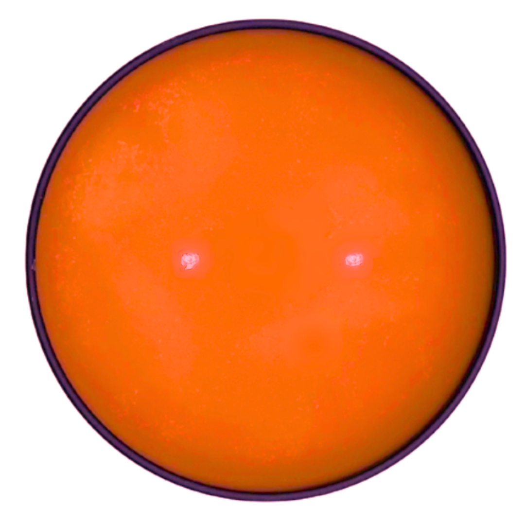 Mbodi 15 oz soy candle ‘No Troubles’ with soft toned soy wax top side down with orange wax and two wicks designed for calm, ease, and a worry free atmosphere