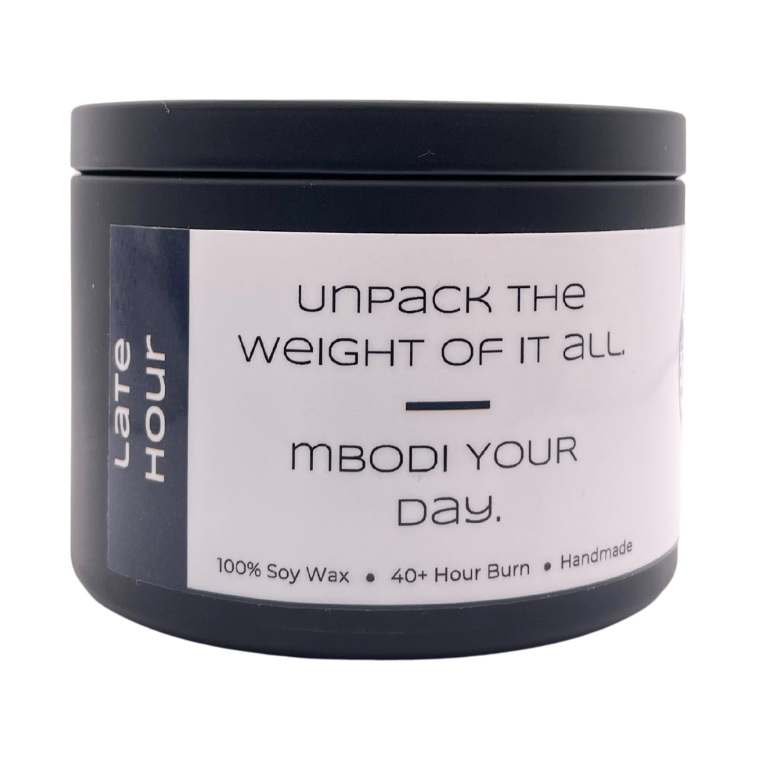 Mbodi 6 oz soy candle ‘Late Hour’ in metal tin with dark grey label designed for a calm, end of day atmosphere and quiet reflection