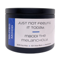 Mbodi 6 oz soy candle ‘Muted Mood’ in metal tin with blue label, crafted for a gentle, low energy, introspective environment