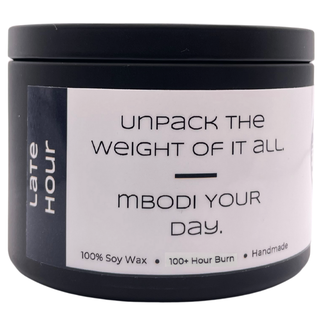 Mbodi 15 oz soy candle ‘Late Hour’ in metal tin with dark grey label designed for a calm, end of day atmosphere and quiet reflection