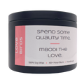 Mbodi 6 oz soy candle ‘Love Birds’ in metal tin with bright pink label designed for a warm, romantic atmosphere and connection