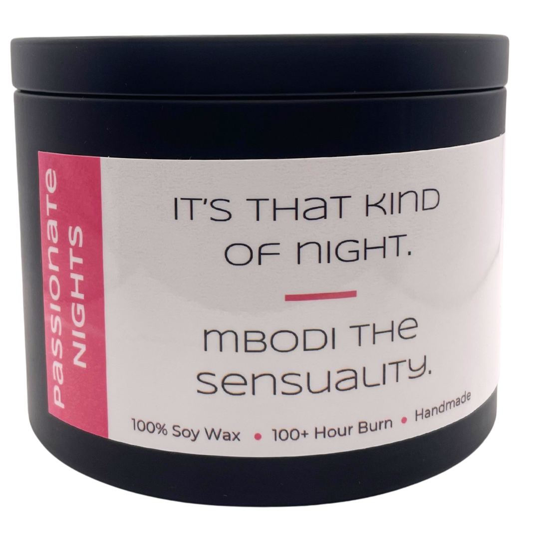 Mbodi 15 oz soy candle ‘Passionate Nights’ in metal tin with pink label designed for a warm, intimate mood