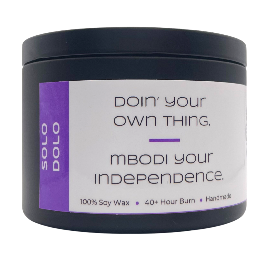 Mbodi 6 oz soy candle ‘Solo Dolo’ in metal tin with Purple label designed for independence and self reflection