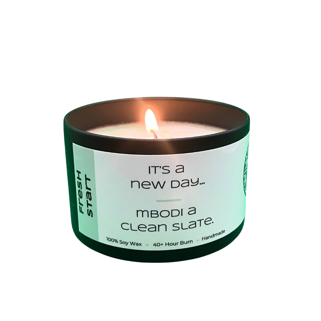 Fresh Start 6oz candle lit with lid off
