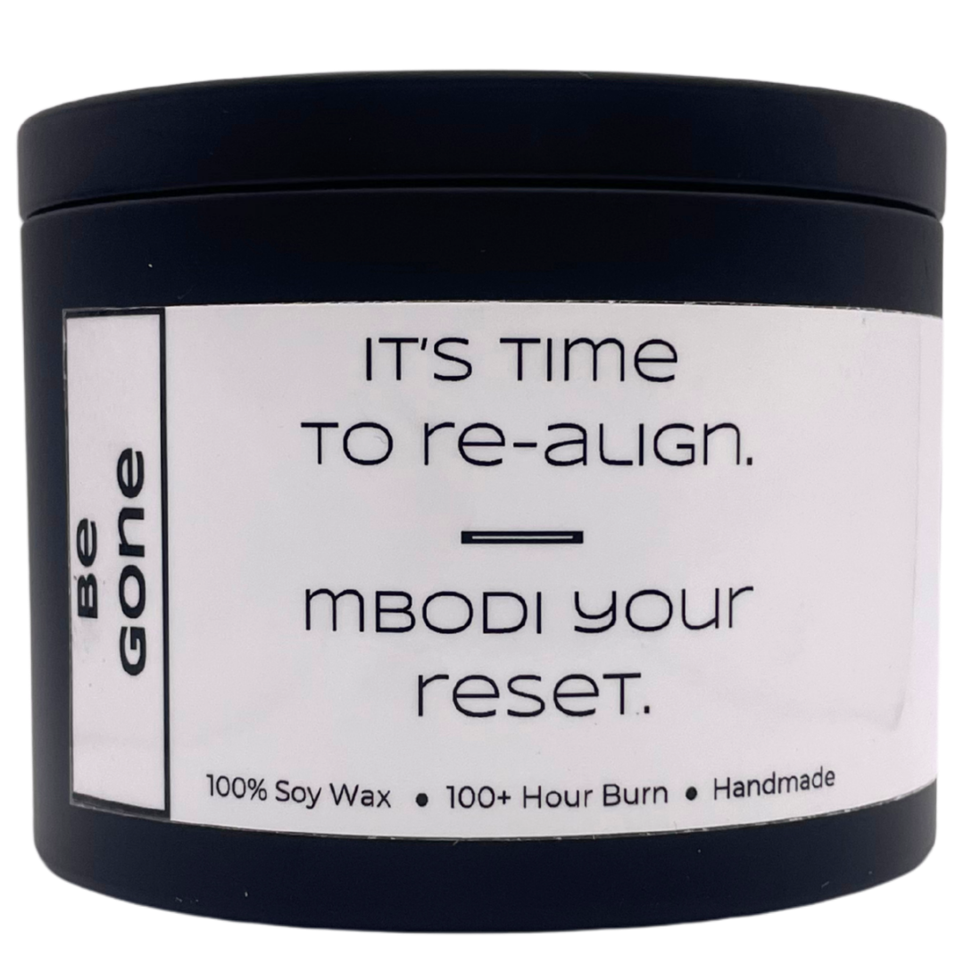 Mbodi 15 oz soy candle ‘Be Gone’ in metal tin with minimal label, crafted for release, cleansing, and emotional clarity