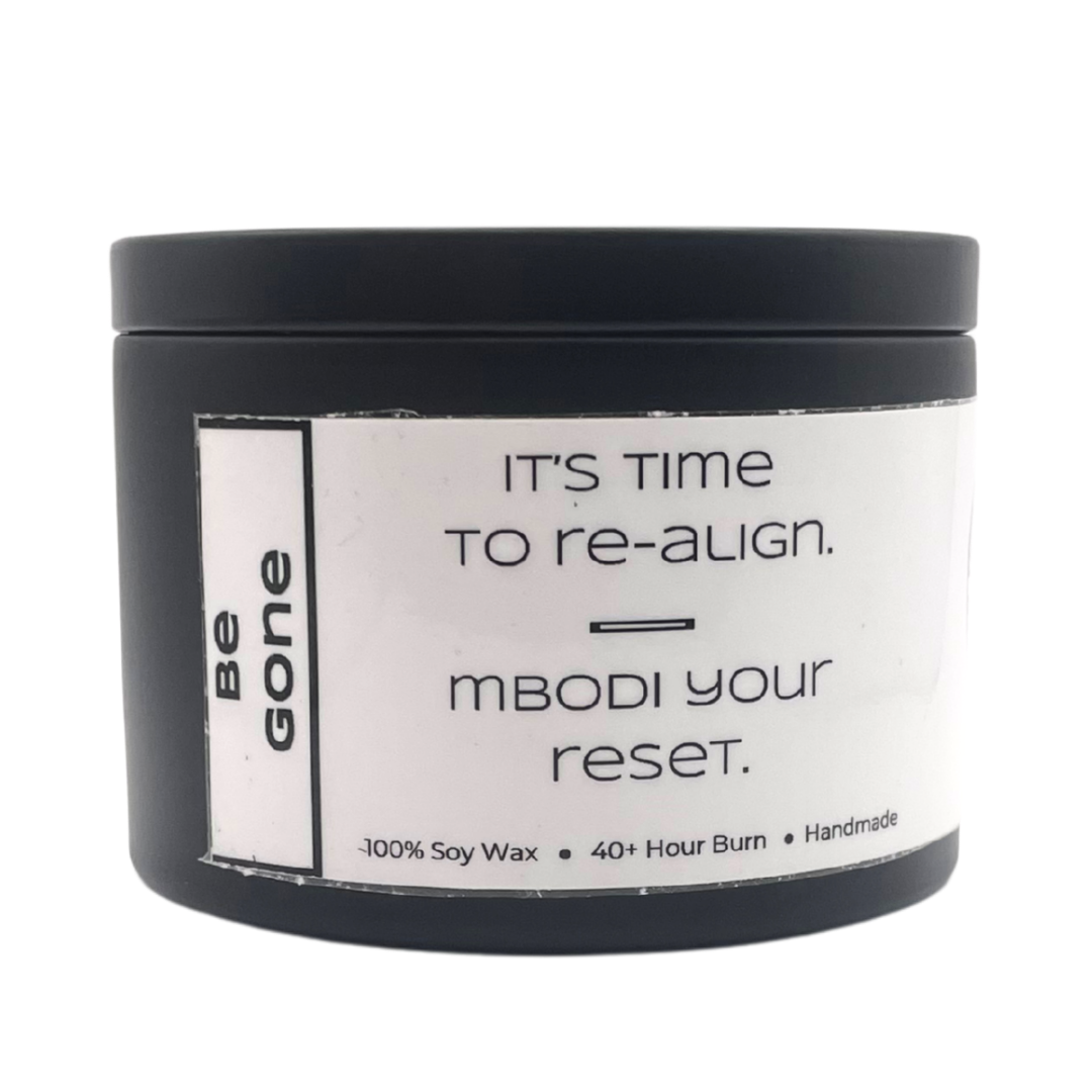 Mbodi 6 oz soy candle ‘Be Gone’ in metal tin with minimal label, crafted for release, cleansing, and emotional clarity
