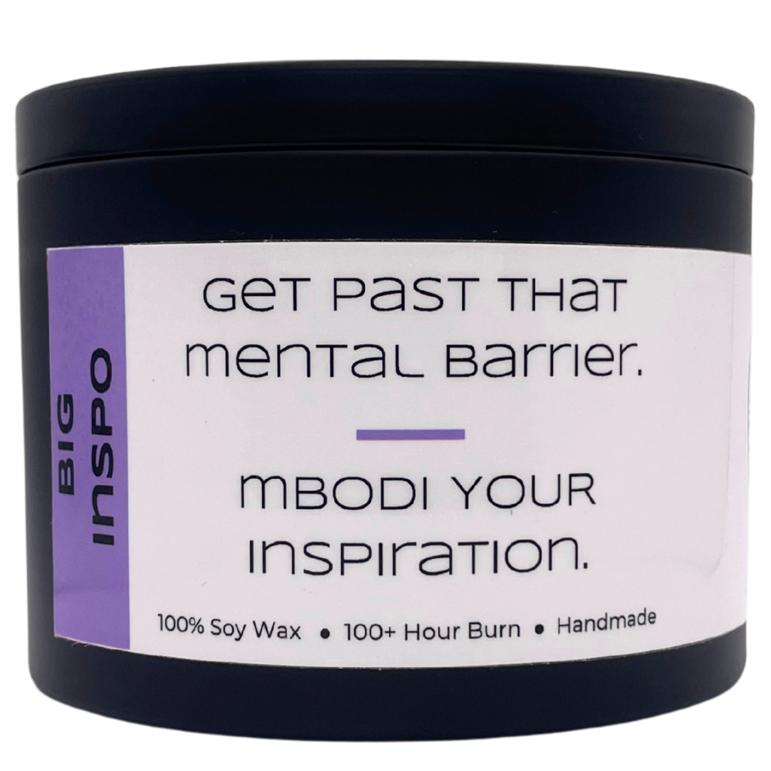 Mbodi 15 oz soy candle ‘Big Inspo’ in metal tin with light purple minimal label, crafted for an inspired, high energy, and focused environment