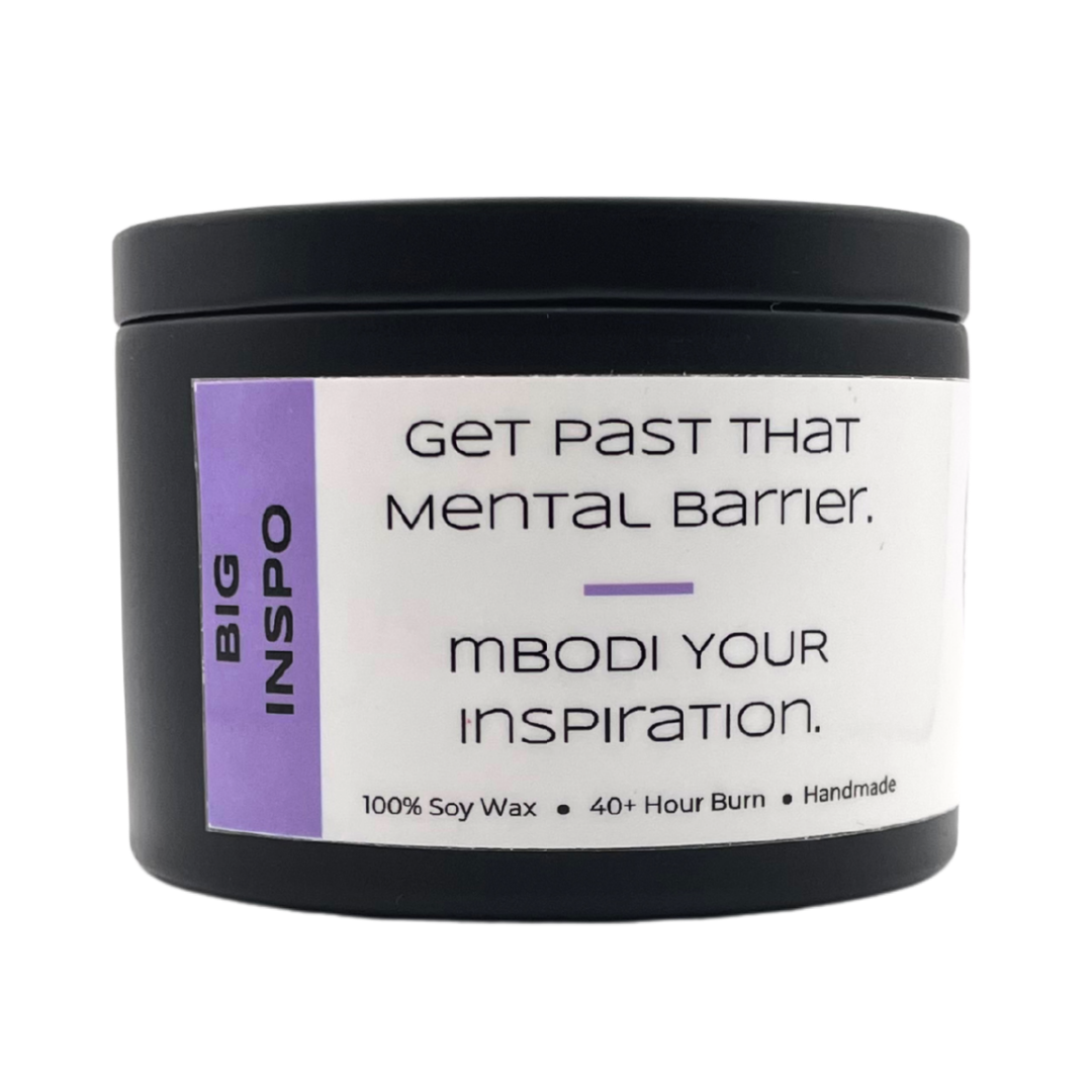 Mbodi 6 oz soy candle ‘Big Inspo’ in metal tin with light purple minimal label, crafted for an inspired, high energy, and focused environment
