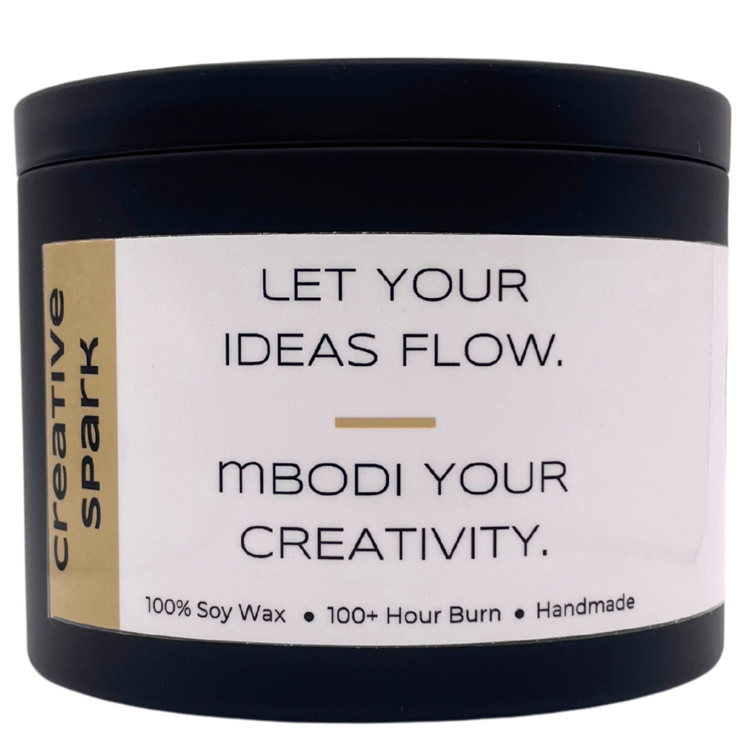 Mbodi 15 oz soy candle ‘Creative Spark’ in metal tin with minimal label, crafted for an inspired, focused, and imaginative environment