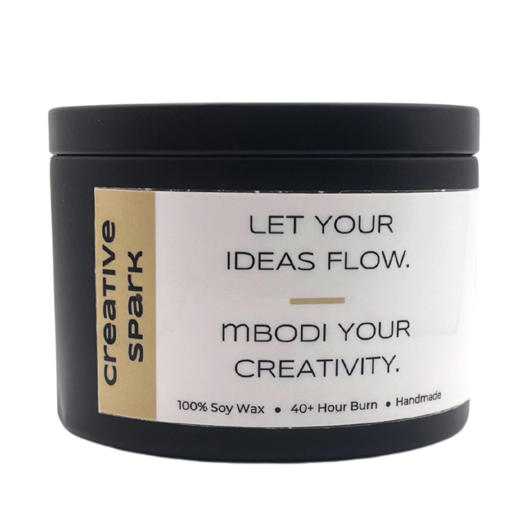 Mbodi 6 oz soy candle ‘Creative Spark’ in metal tin with minimal label, crafted for an inspired, focused, and imaginative environment