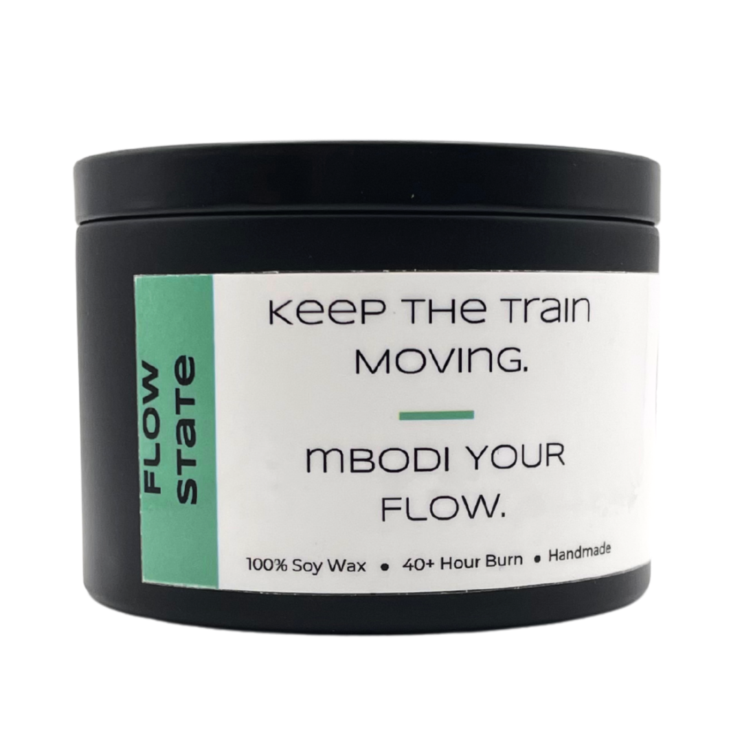 Mbodi 6 oz soy candle ‘Flow State’ in metal tin with minimal peppermint green label, crafted for focused, uninterrupted, and productive energy