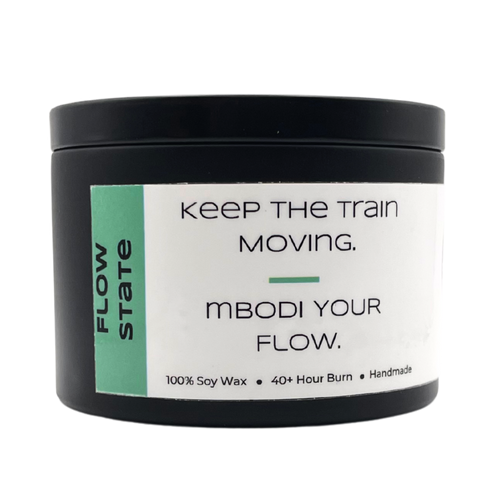 Mbodi 6 oz soy candle ‘Flow State’ in metal tin with minimal peppermint green label, crafted for focused, uninterrupted, and productive energy