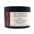 Mbodi 6 oz soy candle ‘Fully Grounded’ in metal tin with soft toned red label designed for stability, balance, and a calm grounded atmosphere