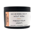 Mbodi 6 oz soy candle ‘Imagine That’ in metal tin with soft toned peach label designed for creativity, curiosity, and open minded thinking