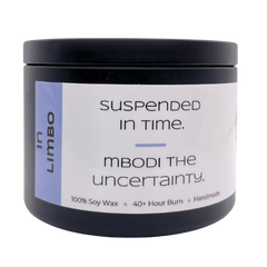 Mbodi 6 oz soy candle ‘In Limbo’ in metal tin with soft toned light blue label designed for a reflective, in between atmosphere