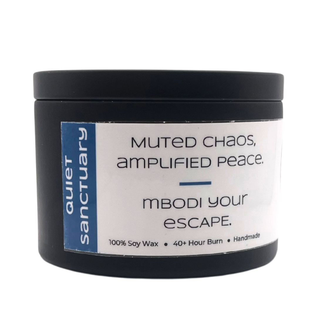 Mbodi ‘Quiet Sanctuary’ 6 oz soy candle in tin, created to bring stillness, comfort, and a sense of emotional safety with its earthiness 